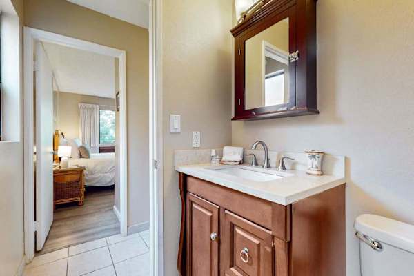 Newly update bathroom remodel with a walk in tiled shower and updated fixtures.
