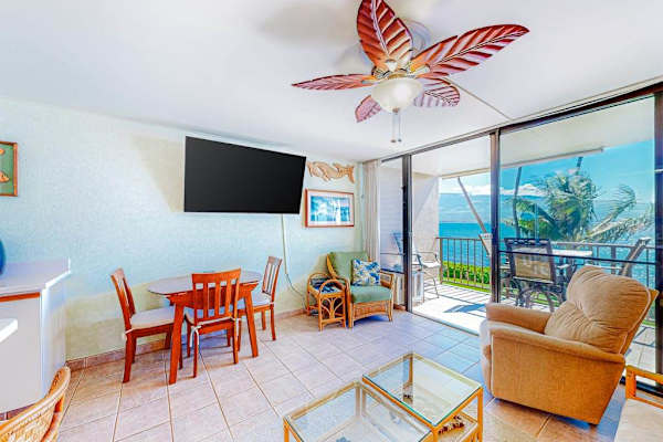 Living room with lots of natural light and an open concept feel with a flatscreen tv.