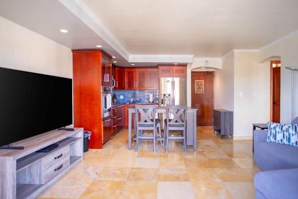 Open living, dining, and kitchen layout creates a spacious and inviting space for relaxing or entertaining.