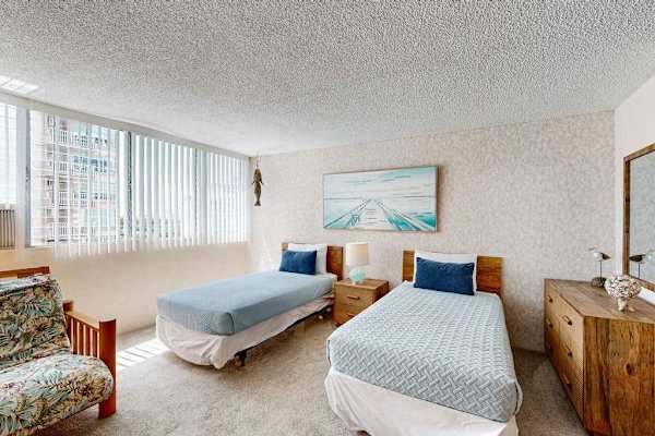 Natural light fills the sleeping area, creating a bright and inviting space to unwind.