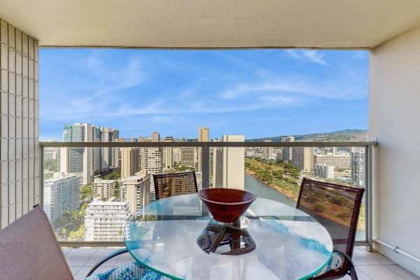 Enjoy outdoor dining on the private balcony overlooking Honolulu and the scenic Ala Wai Canal.