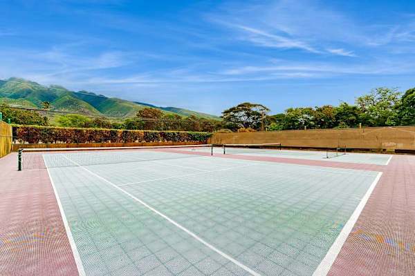 Outdoor court provides a spacious recreational area beneath blue skies