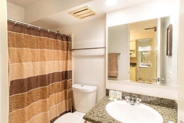 Enjoy the convenience of a full bathroom featuring both a refreshing shower and a relaxing tub.