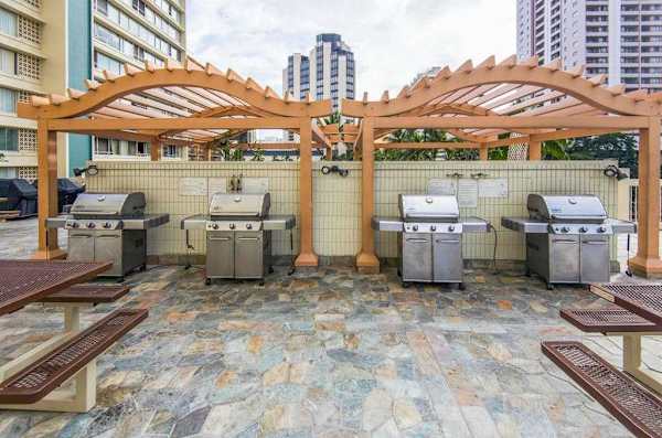 Enjoy easy outdoor cooking and shared meals in this convenient poolside grilling space.
