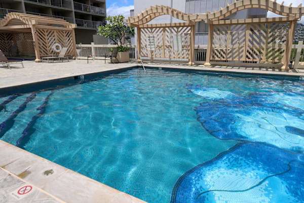 Unwind by the shared resort pool and enjoy a refreshing escape during your stay.