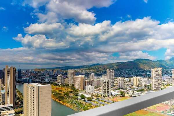 Sip your morning coffee against a spectacular backdrop of blue seas and towering mountains.