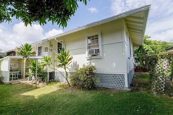 Relax outdoors in the peaceful backyard surrounded by tropical island charm daily
