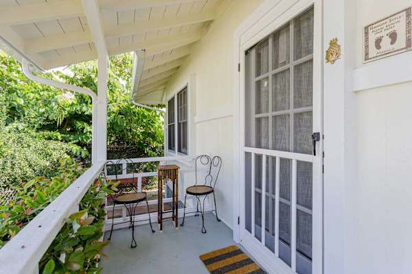 A warm welcome awaits behind this inviting cottage front entrance every time