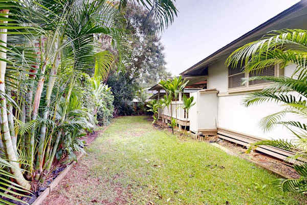 Enjoy peaceful moments in the backyard framed by lush natural greenery everywhere
