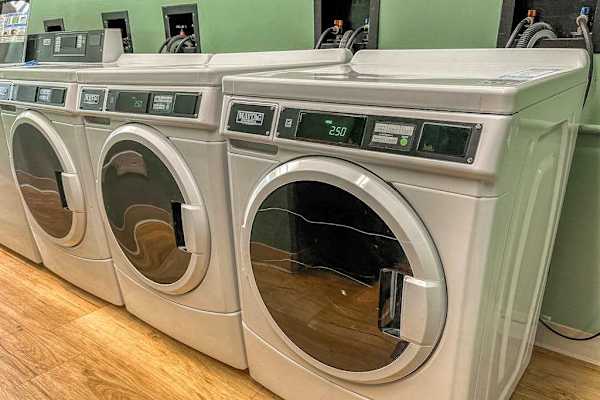 On-Site Shared Laundry Room with Commercial Front-Load Washers
