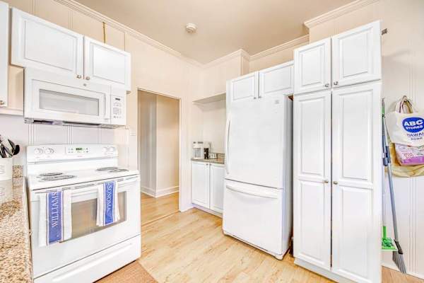 Open kitchen offers generous counters and easy dining room access