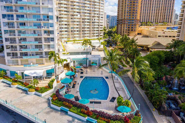 Aerial perspective highlights the spacious shared pool and relaxing outdoor surroundings beautifully