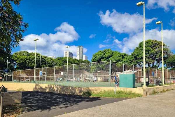Perfect your backhand while enjoying fresh air on shared tennis courts daily