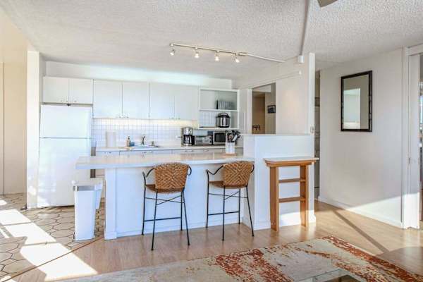 Enjoy extra space for meal preparation, dining, and gathering around the stylish kitchen island.