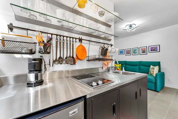 Sleek kitchenette offers convenient space for easy meals