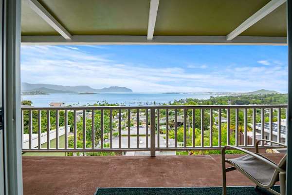 Patio seating with expansive island and ocean views