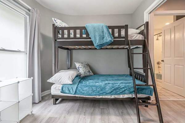 Rest comfortably in this welcoming bedroom space featuring a Queen over Queen bunk