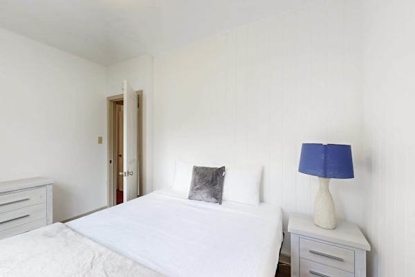 Relax and recharge in a comfortable bedroom featuring a queen-size bed for a restful stay.