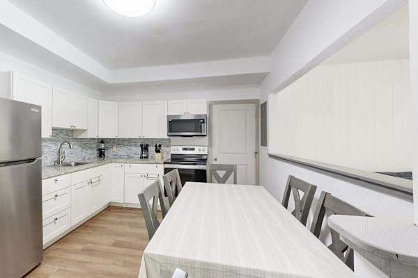 A welcoming space where guests can enjoy meals, conversations, and the convenience of a connected kitchen.