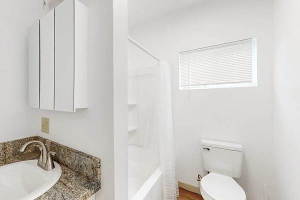 Refresh and unwind in a comfortable bathroom featuring both a bathtub and shower.