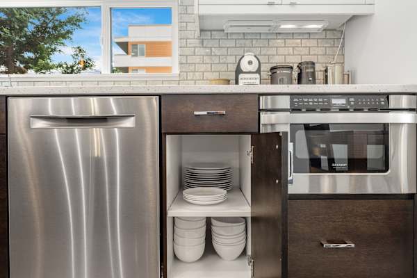 Glasses, plates, and mugs provided. Easy access to everything you need.