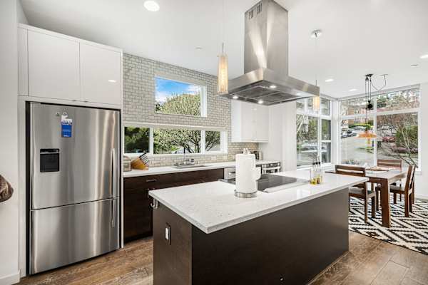 Cook full meals or gather around the island—bright layout with modern appliances.