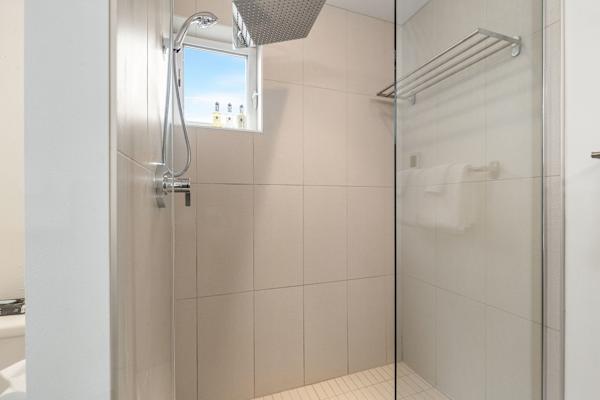 Rain shower with built-in shelving. Bright, simple, and easy to use.