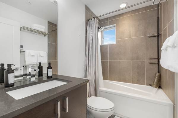 Take a quick shower or wind down in the tub. Clean and tiled throughout.