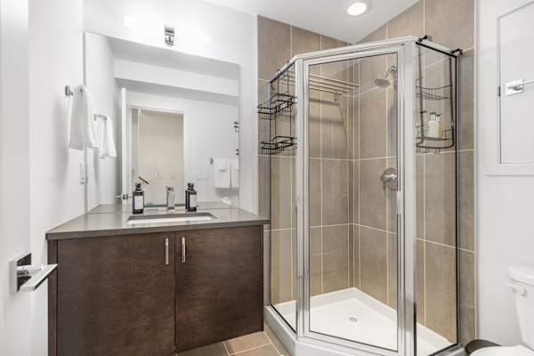 Half bath with modern fixtures. Convenient for quick use from the living area.