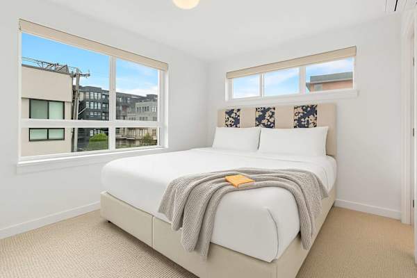 Rest in the queen bed or enjoy soft morning light through the corner windows.
