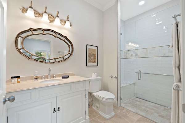 Suite 10 bathroom with walk-in shower and shower bench