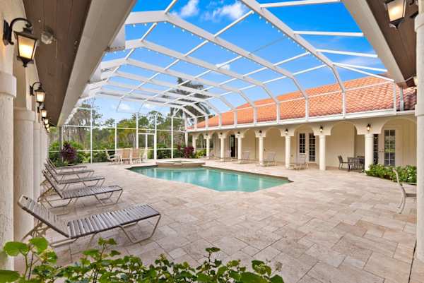 Spacious heated pool and hot tub; lounge chairs