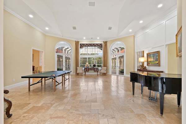 Living room with ping pong table and piano