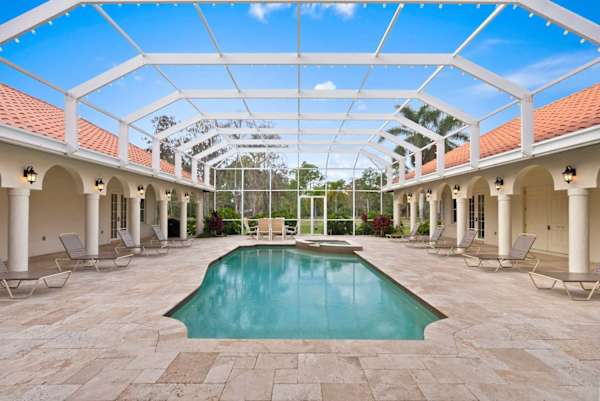 Spacious heated pool and hot tub; lounge chairs