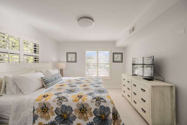 Beautiful Bedrooom with King size bed and natural light; Two nightstand and dresser; TV