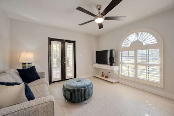 Living room with TV and fan; Acces to Patio
