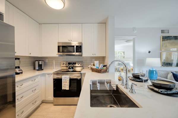 Full size refrigerator, sink, microwave, over, and electric range
