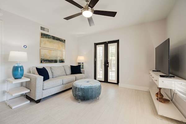 Living room with large sofa and ottoman; Open floor plan