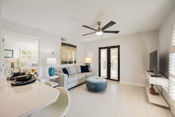 Modern& Bright Living room with large sofa and ottoman.