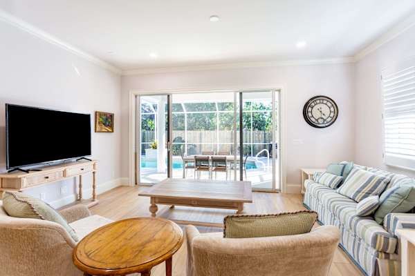 Cozy living room with entrance to the pool