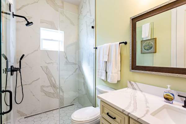 Suite #2 bathroom with zero threshold walk-in shower.