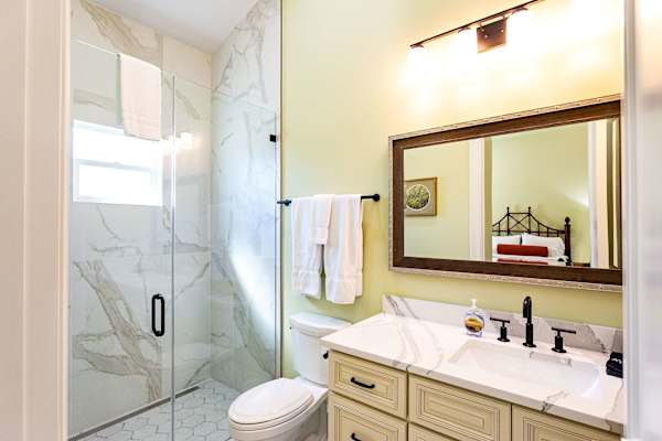 Suite #2 bathroom with zero threshold walk-in shower.