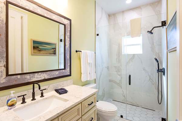 Suite #1 bathroom with zero threshold walk-in shower.