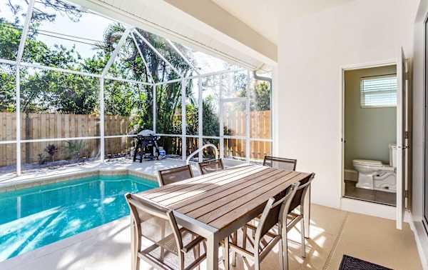 Beautiful Pool with dining area, gas grill, outdoor half bathroom and shower