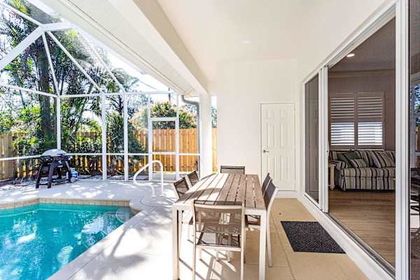 Beautiful Pool with dining area, gas grill, outdoor half bathroom and shower