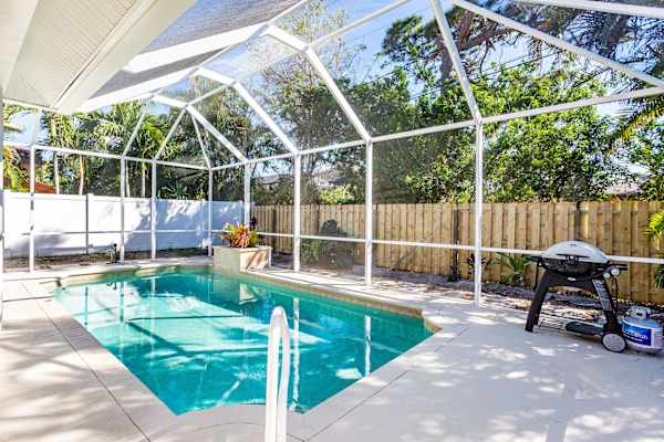 Beautiful Pool with dining area, gas grill, outdoor half bathroom and shower