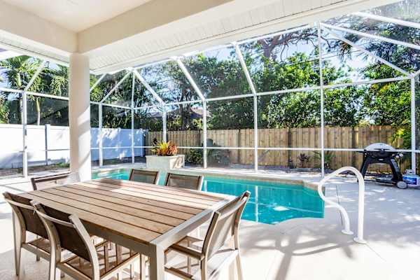 Beautiful Pool with dining area, gas grill, outdoor half bathroom and shower