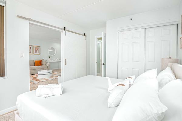 The bedroom has a panel sliding door that separates from the living room for your privacy.