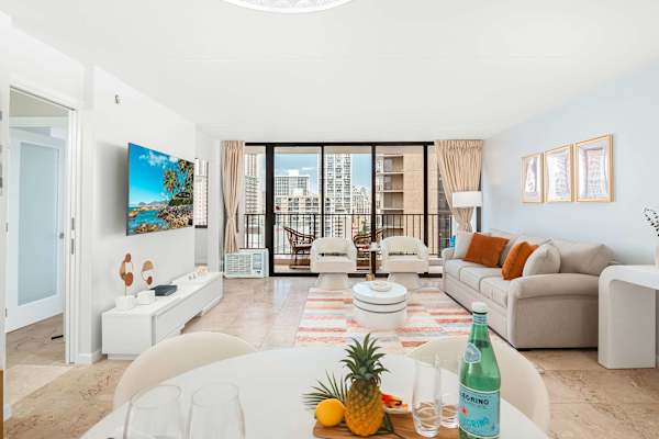 Your dining has a dining table and 4 chairs, and the living area with a pull-out sleeper sofa, and a 65'' Samsung smart TV.