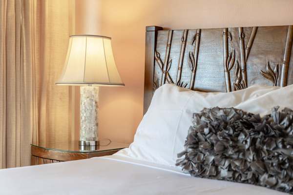Sink into our plush king-sized bed, wrapped in soft linens and fluffy pillows, and wake up refreshed and ready to explore after a night of uninterrupted, cozy sleep.